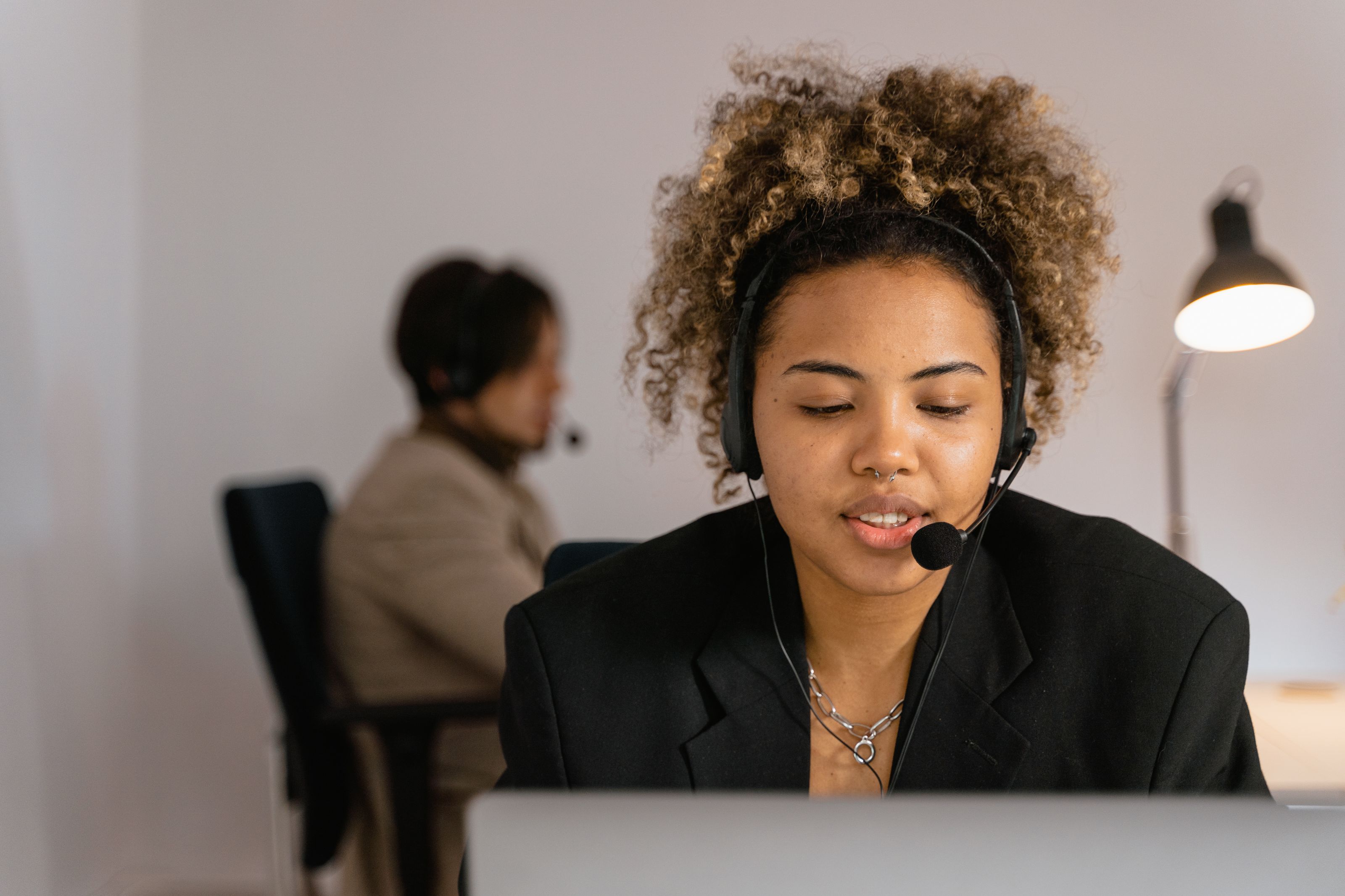 Dedicated PlugPOL customer success representative on a headset